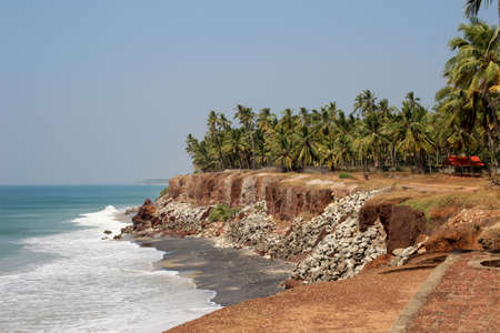 View of the ocean and plenty of palms from the steep in Keralaの写真素材