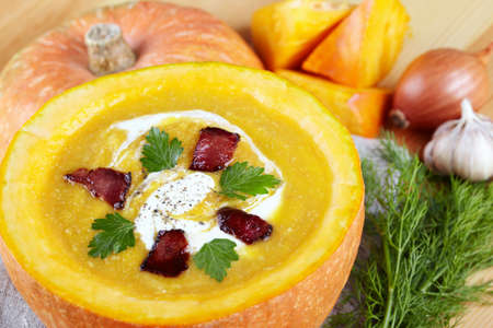 Pumpkin soup served in a pumpkinの写真素材