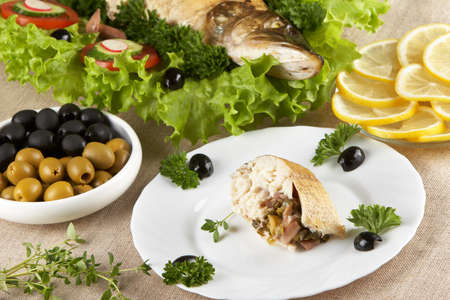 Stuffed pike on a white plateの写真素材