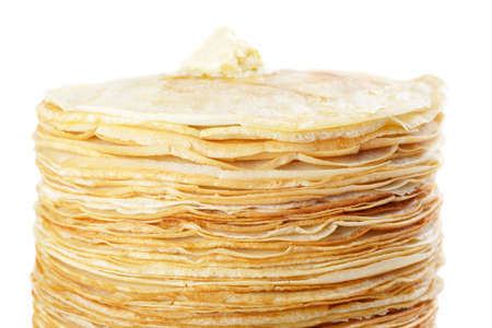 A stack of thin pancakes with butterの写真素材