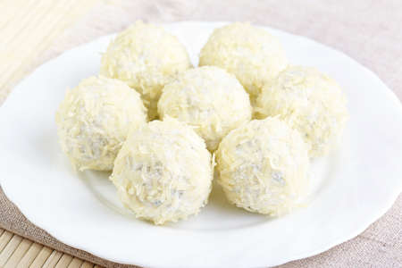 Cheese balls with a tomato cherry inside