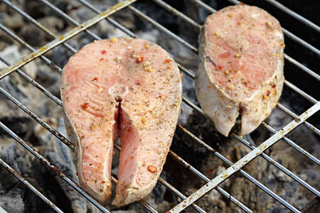 Cooking salmon on the grillの写真素材