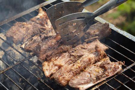 Cooking pork ribs on the grillの写真素材