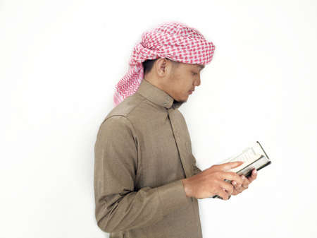 Man Holding and reading quran. Islamic Backgroundの写真素材