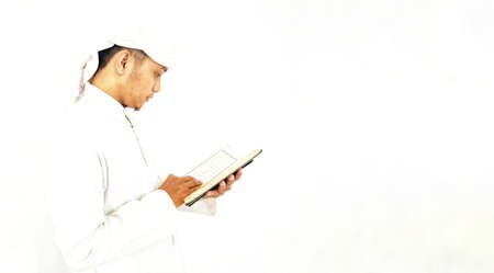 Man Holding and reading quran. Islamic Backgroundの写真素材
