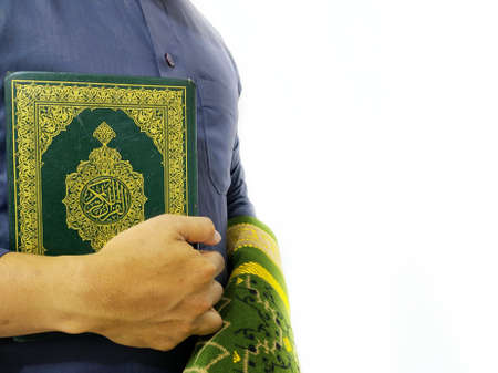 Man Holding and reading quran. Islamic Backgroundの写真素材