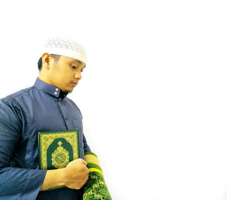 Man Holding and reading quran. Islamic Backgroundの写真素材