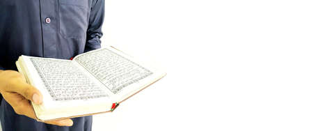 Man Holding and reading quran. Islamic Backgroundの写真素材