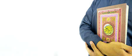 Man Holding and reading quran. Islamic Background