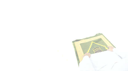 Close up view of Muslim man praying on white background with copy space