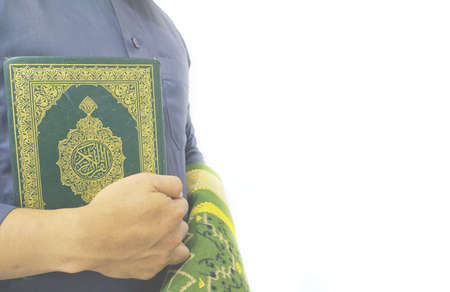 Man Holding and reading quran. Islamic Background