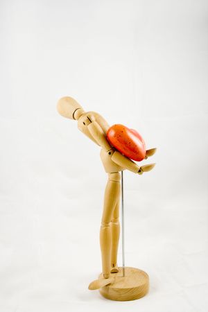 Symbol of love, manikin giving a heartの写真素材