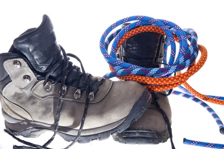 Pair of hiking boots and ropes on white backgroundの写真素材