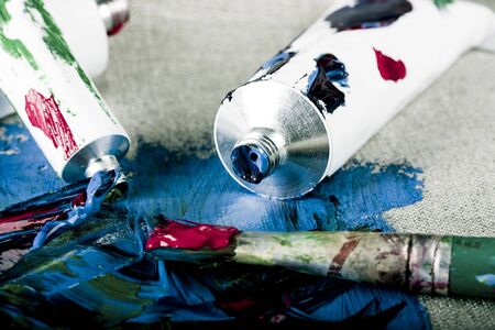 Paint tubes on linen canvas 