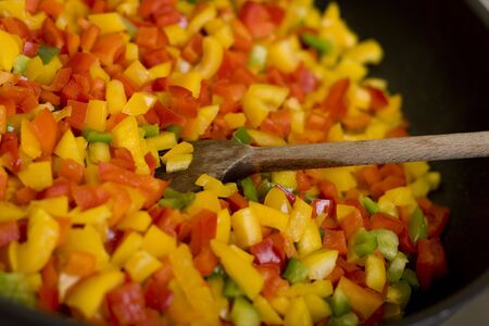 red and yellow paprika cut in squaresの写真素材