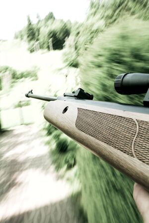 Man holds gun in his handの写真素材