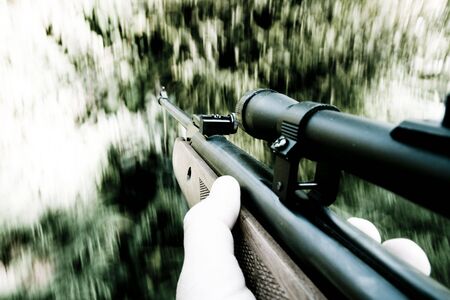 Man holds gun in his handの写真素材