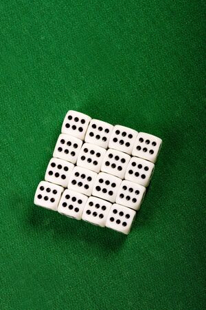 Playing cubes on green table