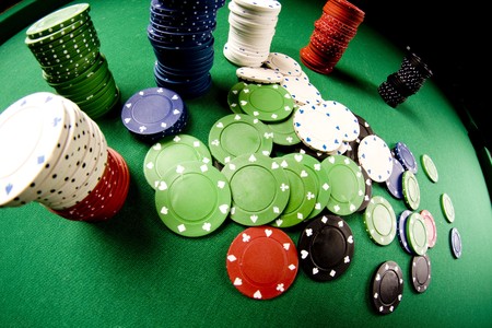  Casino gambling chips on green tableの写真素材