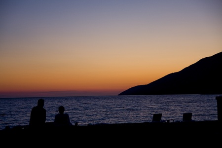 sunset at croatian sea with mountains in backgroundの写真素材