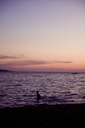 sunset at croatian sea with mountains in backgroundの写真素材