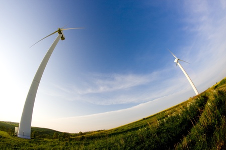Wind turbine on the meadow shown by fisheye lensの写真素材