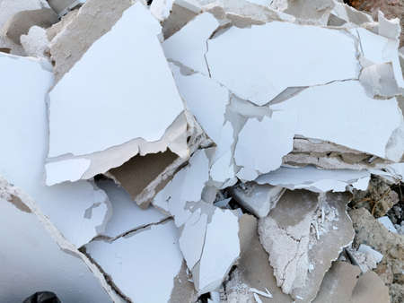 broken pieces of drywall in a heap, building debris with a copy paste placeの写真素材