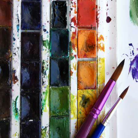 watercolor paints in a set with tassels for artists, art classes, sketchesの写真素材