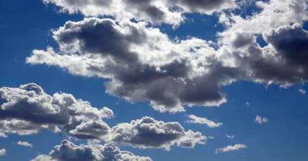 clouds in clear skies with lights from the sun