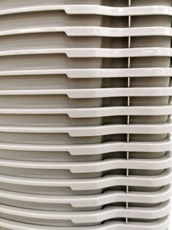 a stack of grey plastic basins