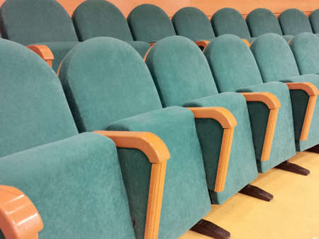 blue chair seats in an empty conference room