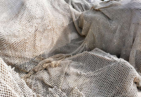 fishing nets and tackles drying on the pavement