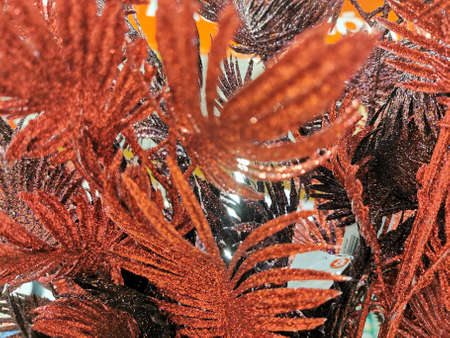 Christmas decor red branches blurred background top view. selective focus, New Year's background. Christmas background.の写真素材
