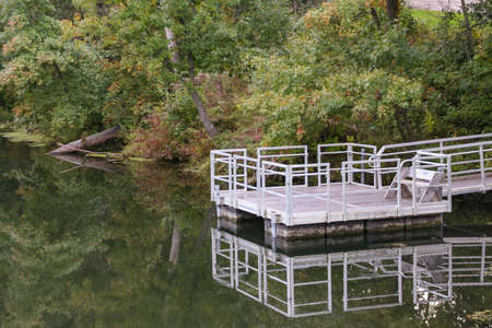 Picture of a fishing dock on a beautiful, calm, and sunny day.の写真素材
