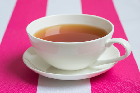 Cup of tea on white-pink napkinの写真素材