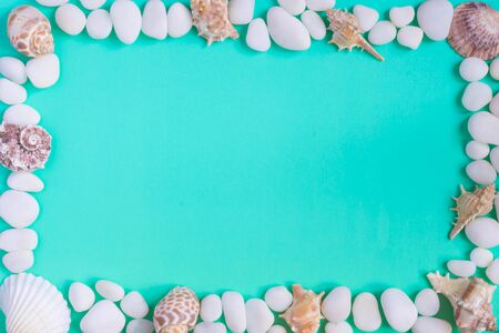 Frame in a marine style with pebbles and seashells. The background color of the sea