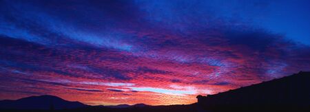 Sunset landscape with silhouettesの写真素材