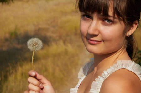 Women's sunset portrait on colored nature backgroundの写真素材