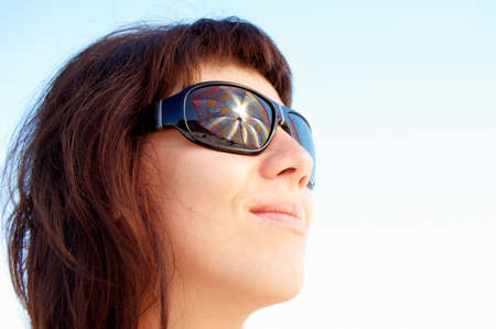 woman with glasses in the seaの写真素材