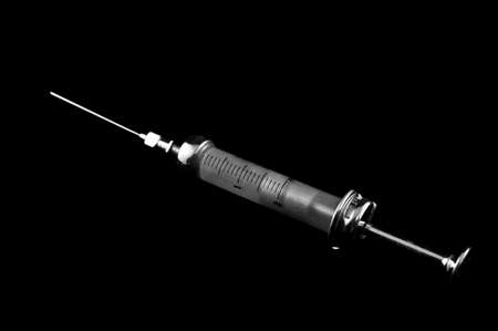 syringe on a black backgroundの写真素材