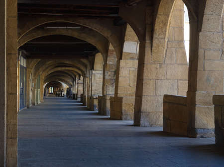 Perspective view under the arcades of Place Saint Louis in Metz with nobody due to coronavirusのeditorial素材