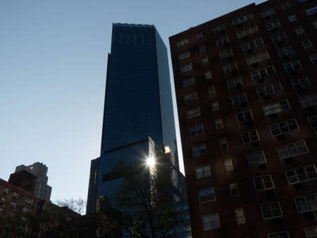 Sun light reflection in glass facade of a high rise building in New York City