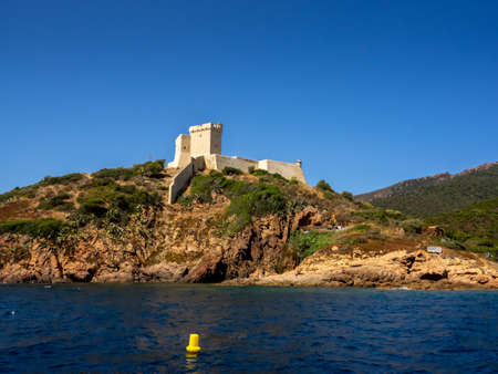 View on the fortress when entering the port of Girolata on a sunny dayのeditorial素材