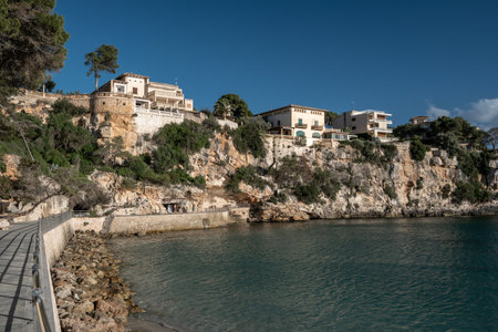 Serene stroll along the seaside when exploring the beauty of Porto Cristo in Mallorca in Spainの写真素材