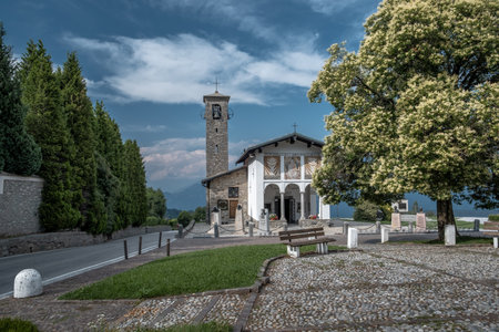A famous church at a pass on a tortuous road along the lake Como in Italyの写真素材