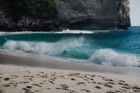 The wonderful colors of the wave of the Kelingking beach in Nusa Penidaの写真素材
