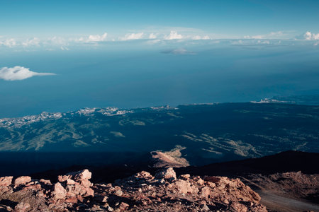 Contrast between the arid landscape of the volcano and the green coast in Tenerifeの写真素材