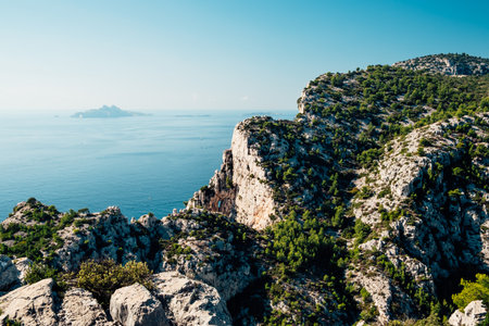 Cliffs overhanging the Mediterranean sea on a sunny day near Cassisの写真素材