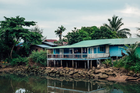 A small wooden house on stilts along the river in Tioman island in Malaysia