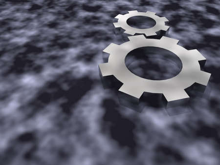 The mechanical gears of their chromeplated metal laying on a futuristic backgroundの写真素材